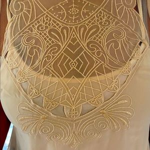 Embroidery cream tunic with underlay.